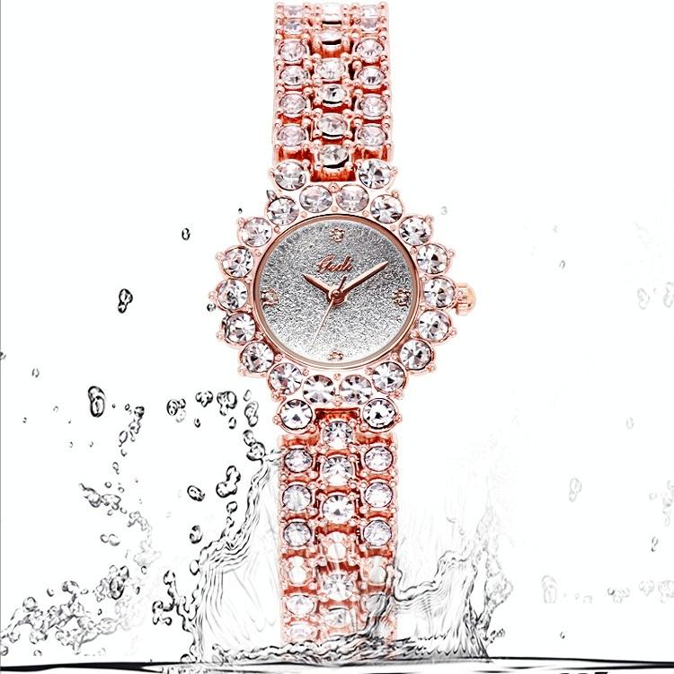 Women Quartz Bracelet Watch with Diamond Accents - Golden Shell Black Plate