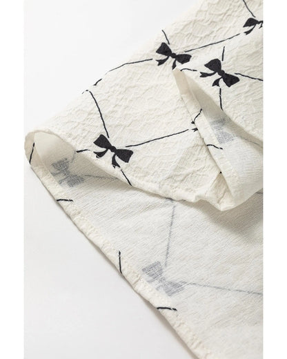 White Bowtie Pattern Textured Puff Half Sleeve Loose Mini Dress - S Femina Worldwide