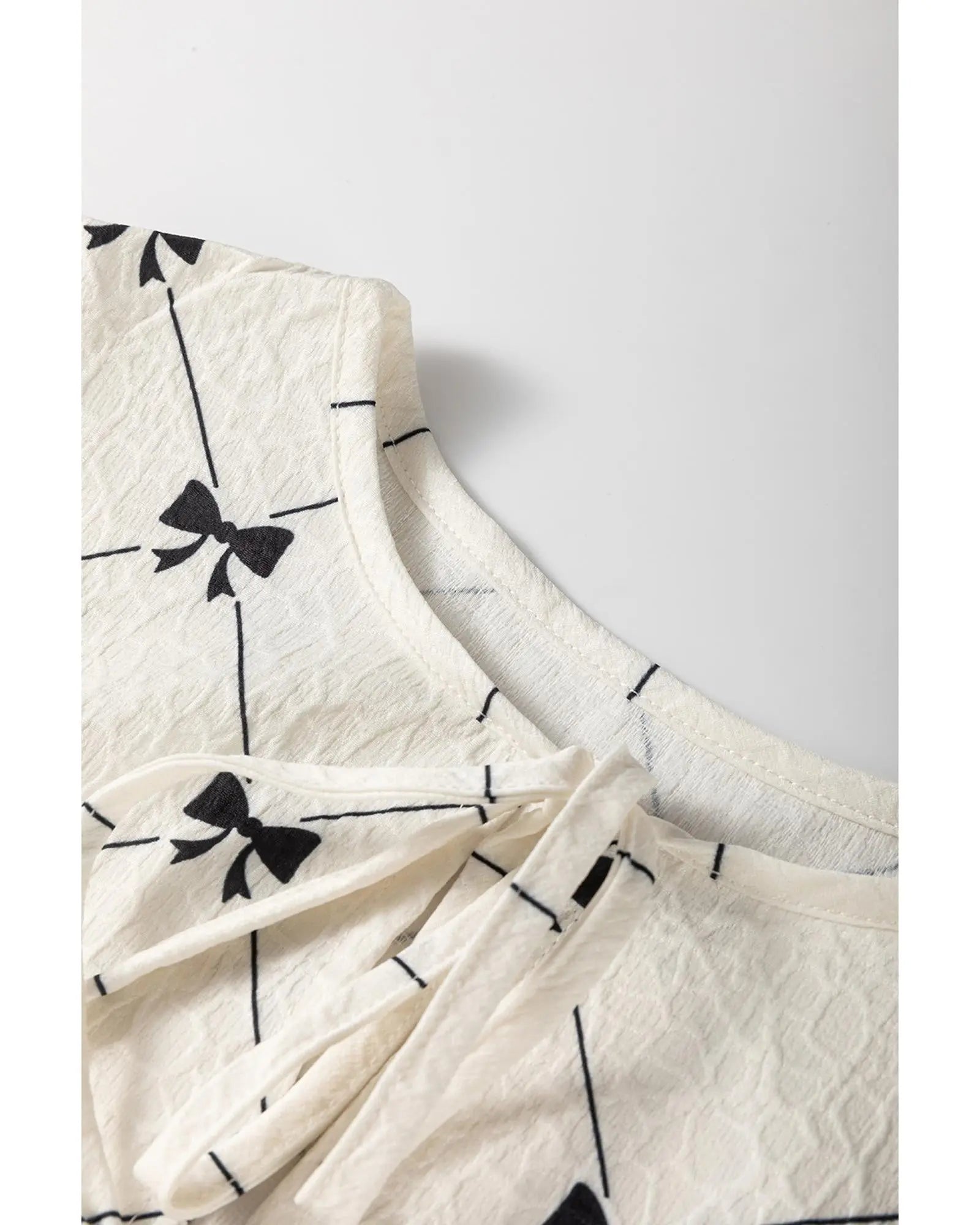 White Bowtie Pattern Textured Puff Half Sleeve Loose Mini Dress - XL Femina Worldwide