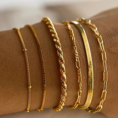 A golden six-piece set Chic Multi-Layered Alloy Bracelet Set - Fashionable Stackable Jewelry Femina Worldwide