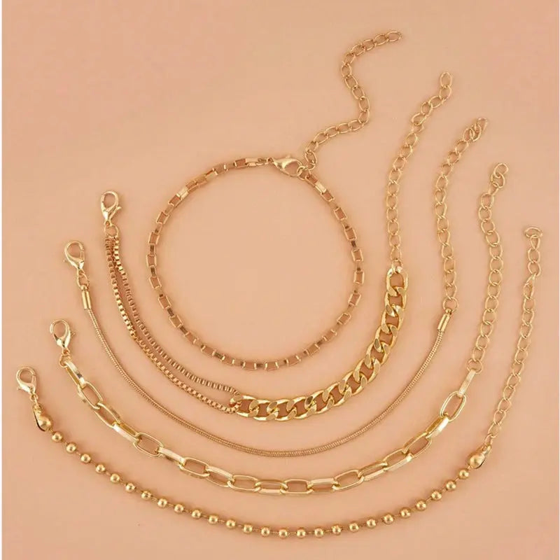 A golden six-piece set Chic Multi-Layered Alloy Bracelet Set - Fashionable Stackable Jewelry Femina Worldwide