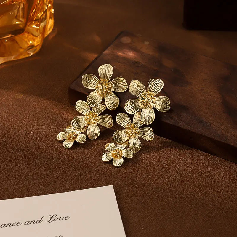 Gold Textured Cascading Floral Statement Drop Earrings for Women Femina Worldwide