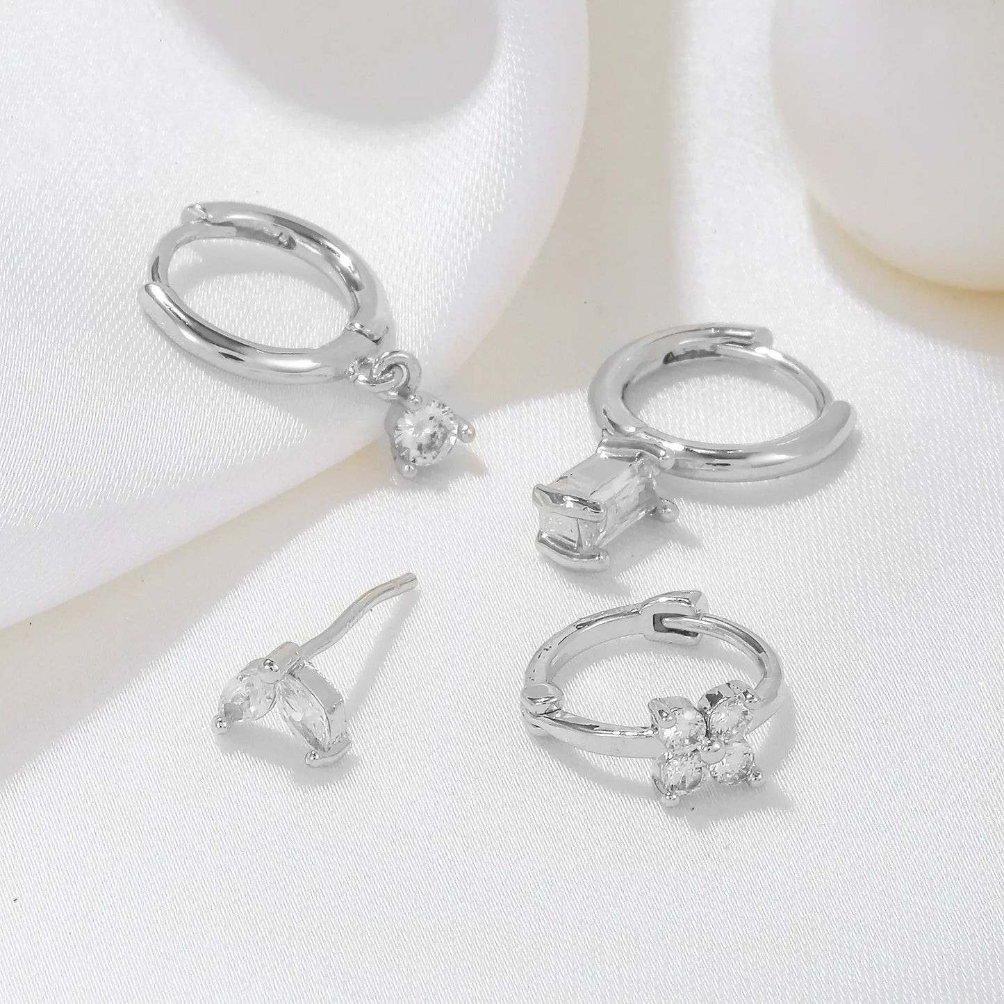Four-piece set Gold Delicate CZ Earring Stacking Set - Huggie Hoops & Studs for Multiple Piercings Femina Worldwide