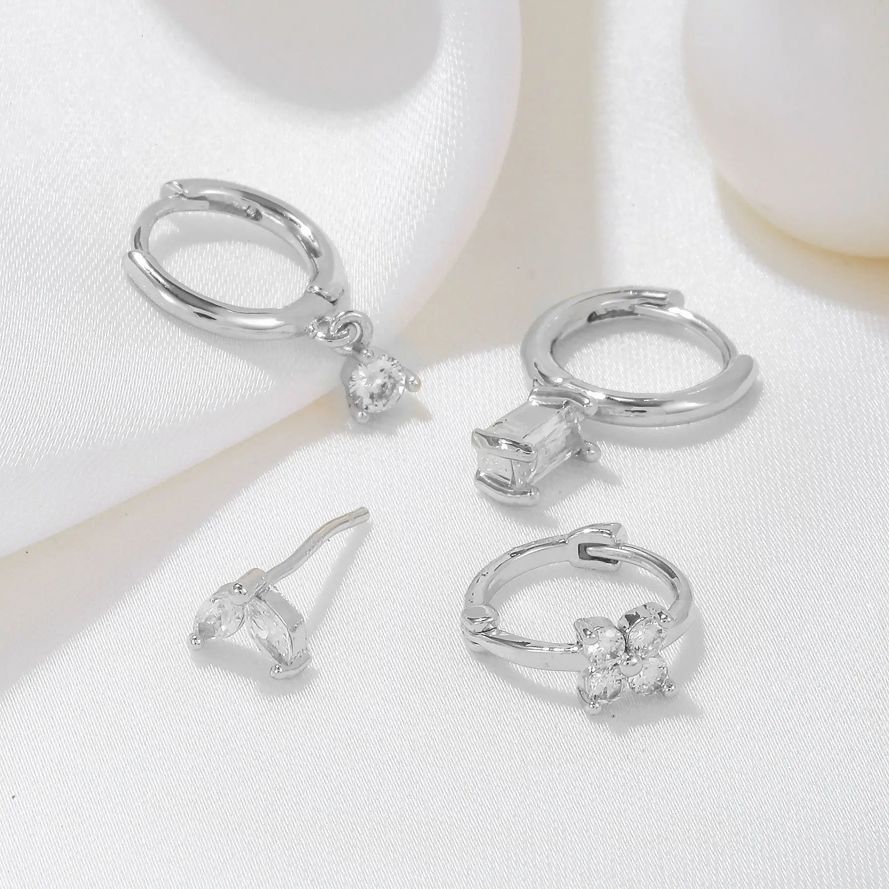 Four-piece set Silver Delicate CZ Earring Stacking Set - Huggie Hoops & Studs for Multiple Piercings Femina Worldwide