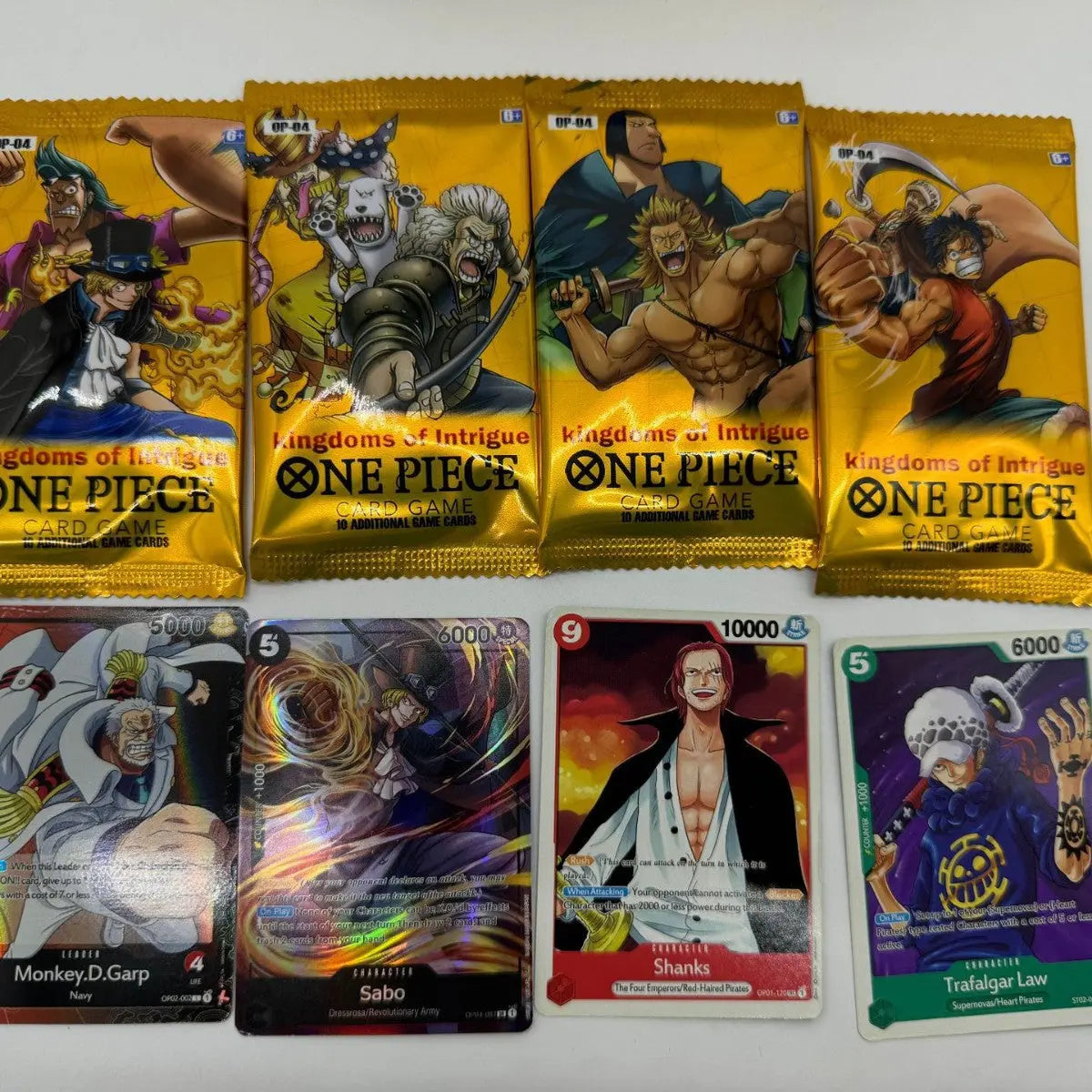 One Piece Themed Trading Card Game 300 Pieces Booster Box Set Kingdoms of Intrigue Anime Battle Collectibles Featuring Sabo Zoro and Sanji Yellow Edition Femina Worldwide